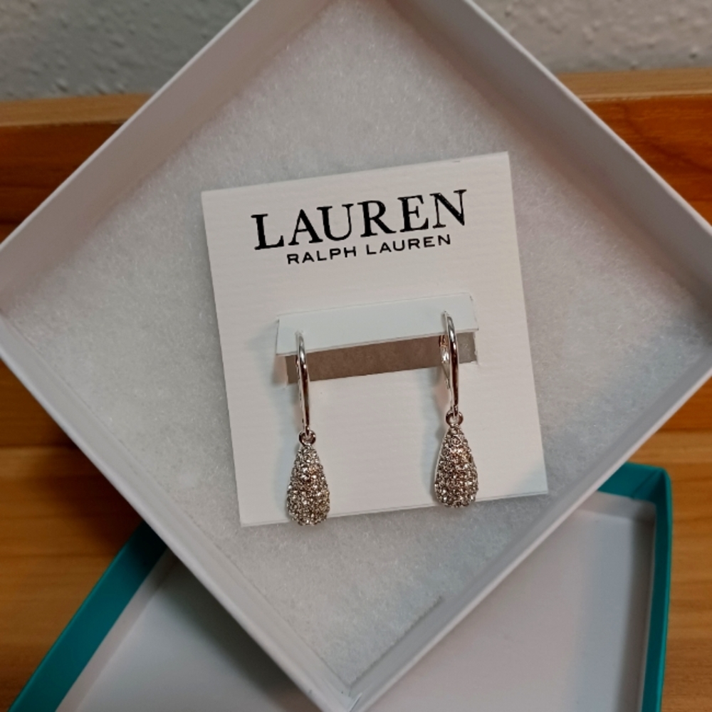 Silver studded tear drop earrings.